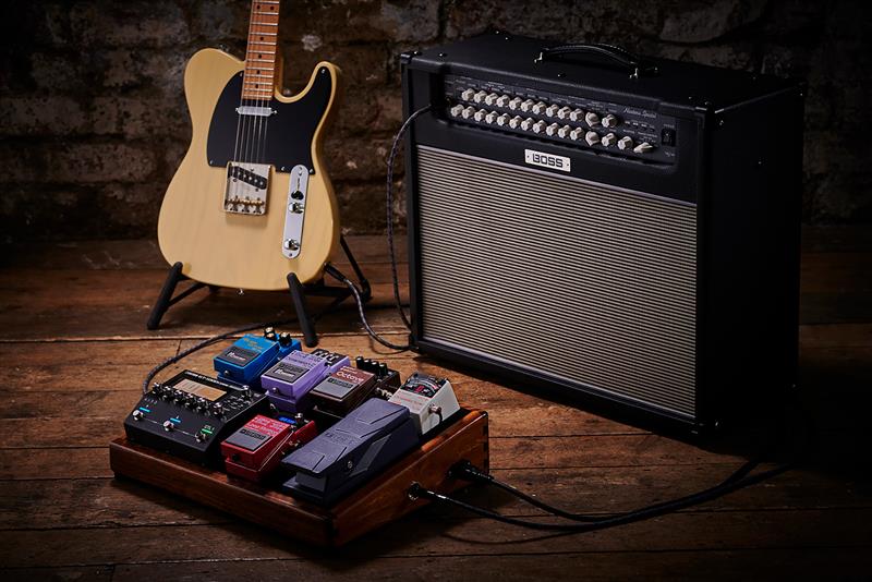 Pedalboard, amp, and guitar