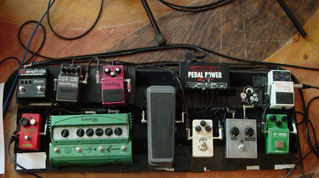 Portishead co-founder Adrian Utley's pedalboard featuring a TU-2 Chromatic Tuner, RV-5 Digital Reverb, and DM-2 Delay.