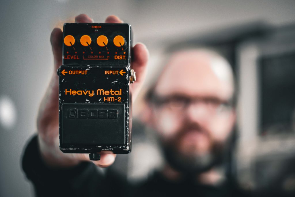 Producer Tom Dalgety holding his BOSS HM-2 Heavy Metal