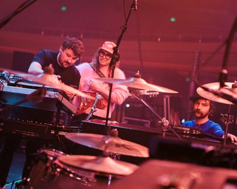 Guitar tech Gavin Maxwell (left) with IDLES guitarists Lee Kiernan (center) and Mark Bowen.