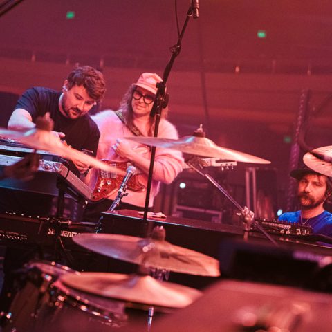 Guitar tech Gavin Maxwell (left) with IDLES guitarists Lee Kiernan (center) and Mark Bowen.