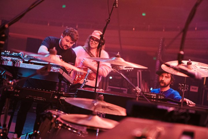 Guitar tech Gavin Maxwell (left) with IDLES guitarists Lee Kiernan (center) and Mark Bowen.