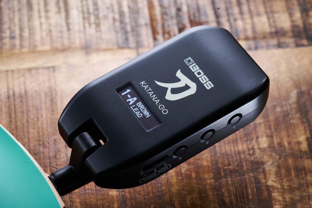 BOSS KATANA:GO Personal Headphone Guitar Amplifier plugged into electric guitar