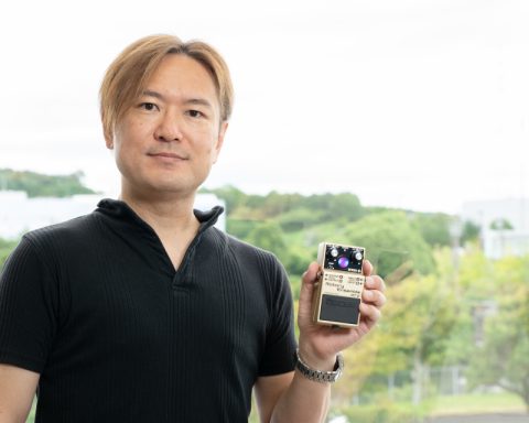 BOSS Engineer Takeshi Mitsuhashi holding the RT-2 Rotary Ensemble