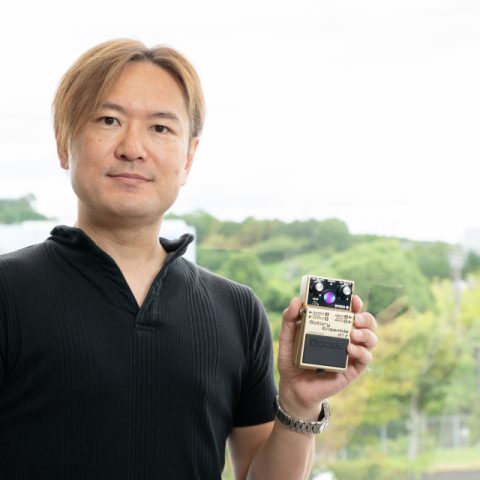 BOSS Engineer Takeshi Mitsuhashi holding the RT-2 Rotary Ensemble