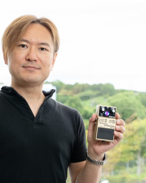 BOSS Engineer Takeshi Mitsuhashi holding the RT-2 Rotary Ensemble