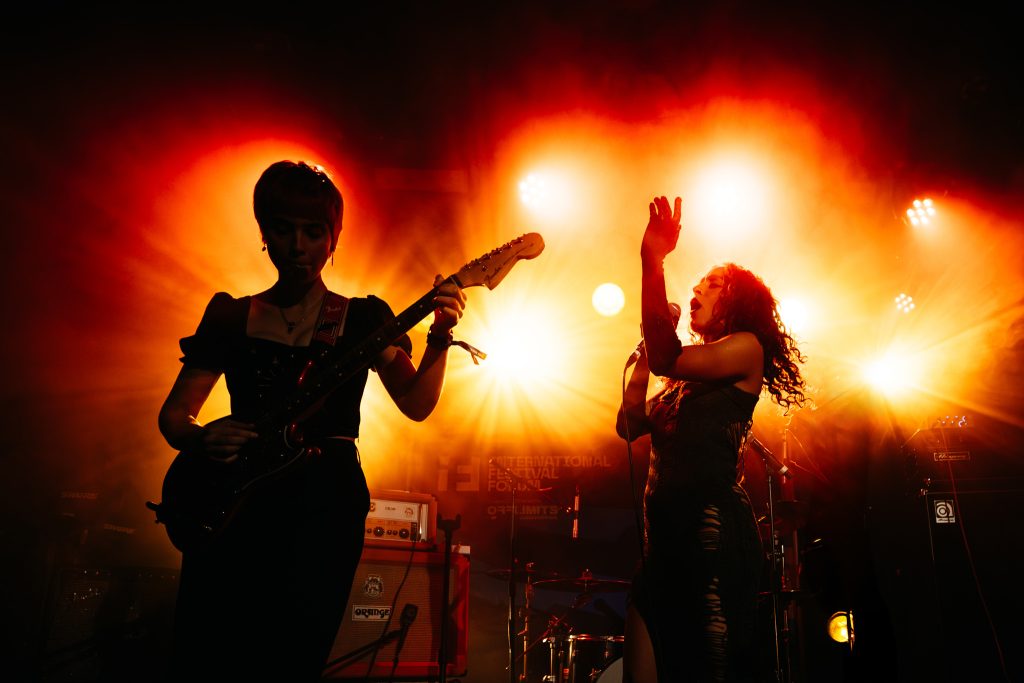 Guitarist Janelle Borg and vocalist Leona Farrugia performing live with ĠENN