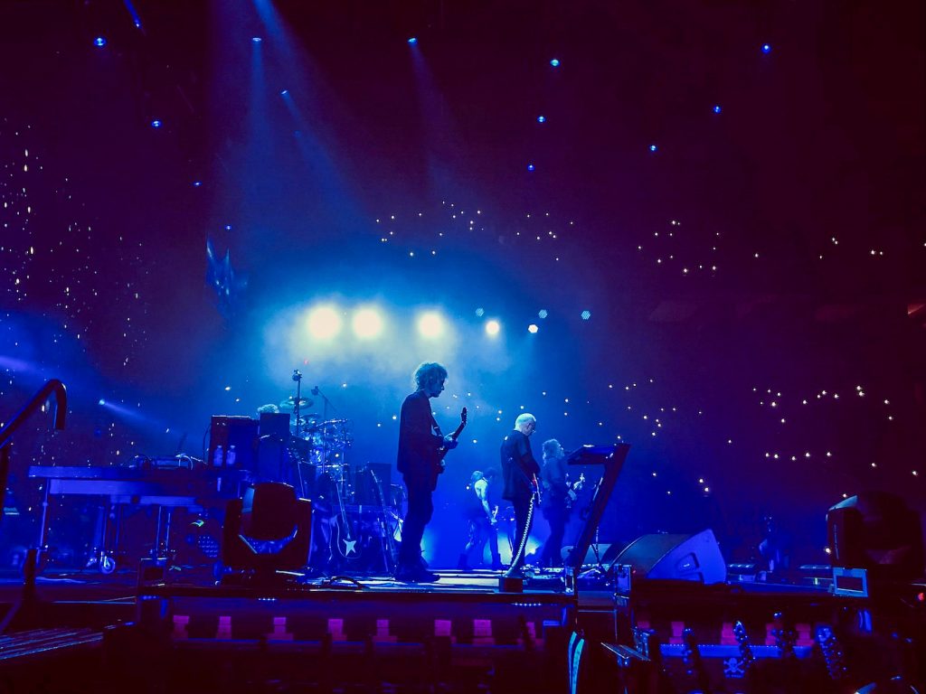 The Cure performing live.