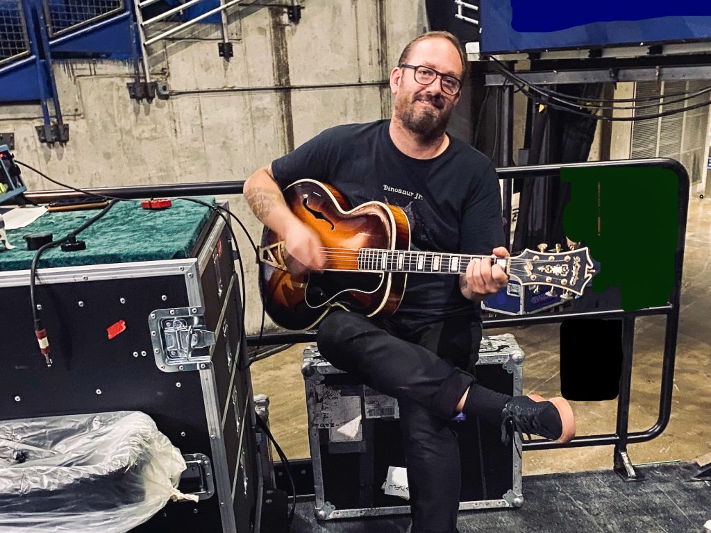 Guitar tech Mattias Johansoon playing a D'Andelico guitar.
