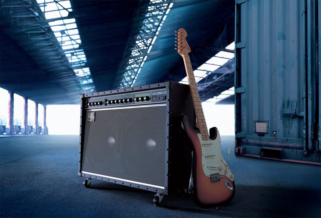 Roland JC-120 Jazz Chorus guitar amplifier pictured with a Fiesta Red Fender Stratocaster.