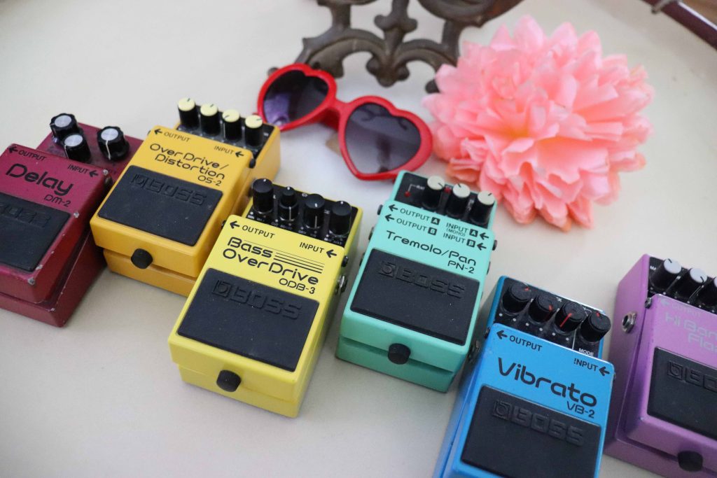 Ella Feingold's BOSS effects pedals including th DM-2 Delay, OS-2 OverDrive/Distortion, ODB-3 Bass OverDrive, PN-2 Tremolo/Pan, VB-2 Vibrato, and HF-2 Hi Band Flanger