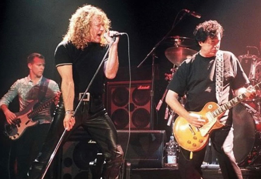 Charlie Jones, Robert Plant, and Jimmy Page performing