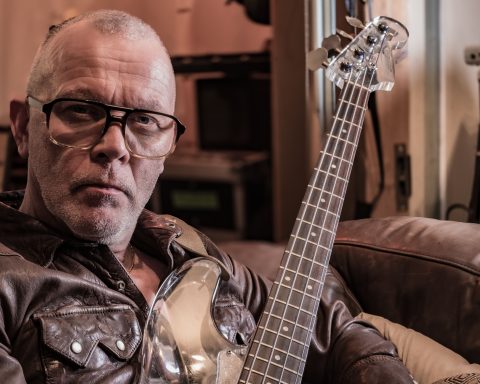 Bassist Charlie Jones (Robert Plant and Jimmy Page, The Cult, Siouxsie Sioux, Goldfrapp) holding his Nightingale plastic bass
