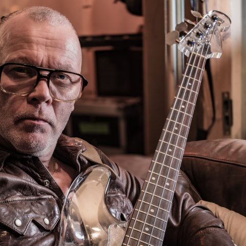 Bassist Charlie Jones (Robert Plant and Jimmy Page, The Cult, Siouxsie Sioux, Goldfrapp) holding his Nightingale plastic bass