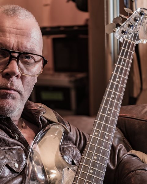 Bassist Charlie Jones (Robert Plant and Jimmy Page, The Cult, Siouxsie Sioux, Goldfrapp) holding his Nightingale plastic bass