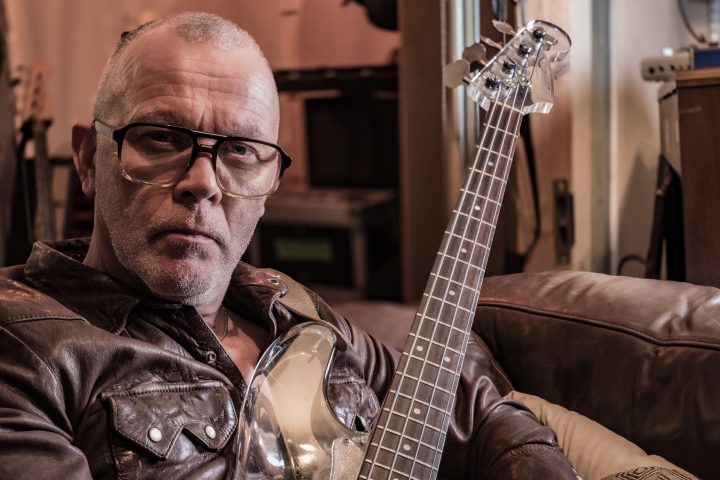 Bassist Charlie Jones (Robert Plant and Jimmy Page, The Cult, Siouxsie Sioux, Goldfrapp) holding his Nightingale plastic bass