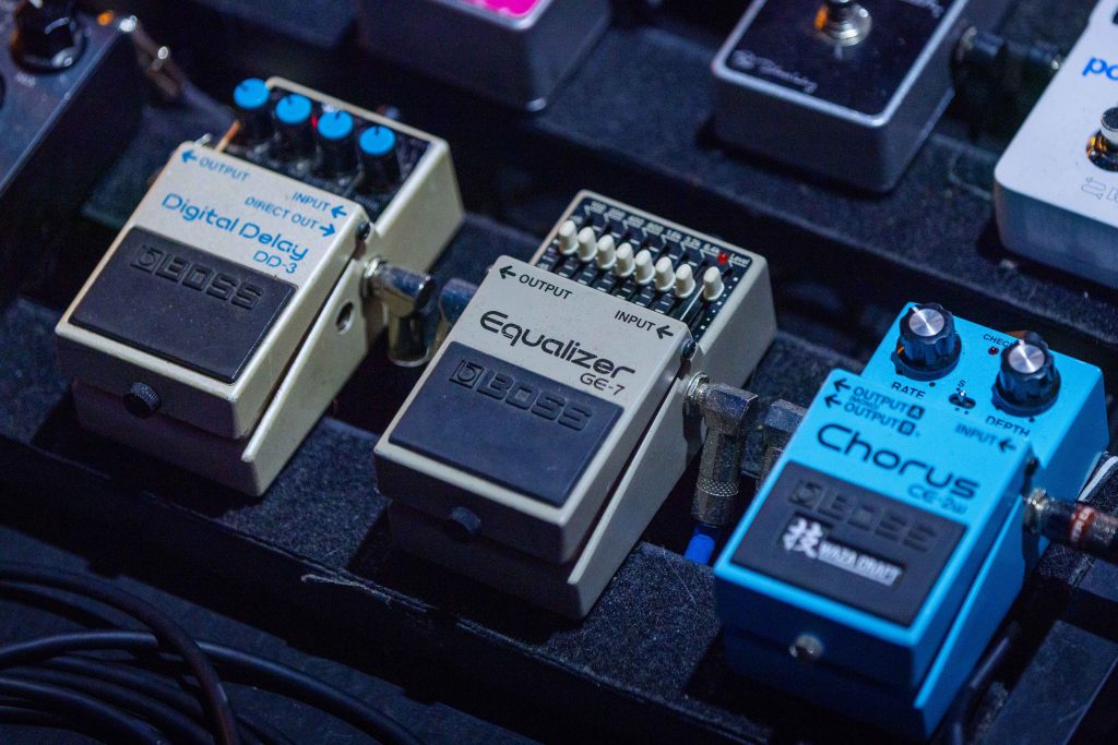 BOSS DD-3 Digital Delay, GE-7 Equalizer, and CE-2W Chorus pictured on Brigitte Calls Me Baby guitarist Jack Fluegel's touring pedalboard.